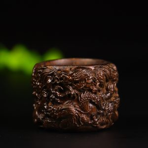 Natural old material black agarwood dragon-shaped finger guard with the theme of the dragon protecting its master.